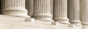 Columns of the United States Supreme Court building, symbolizing strength and justice.